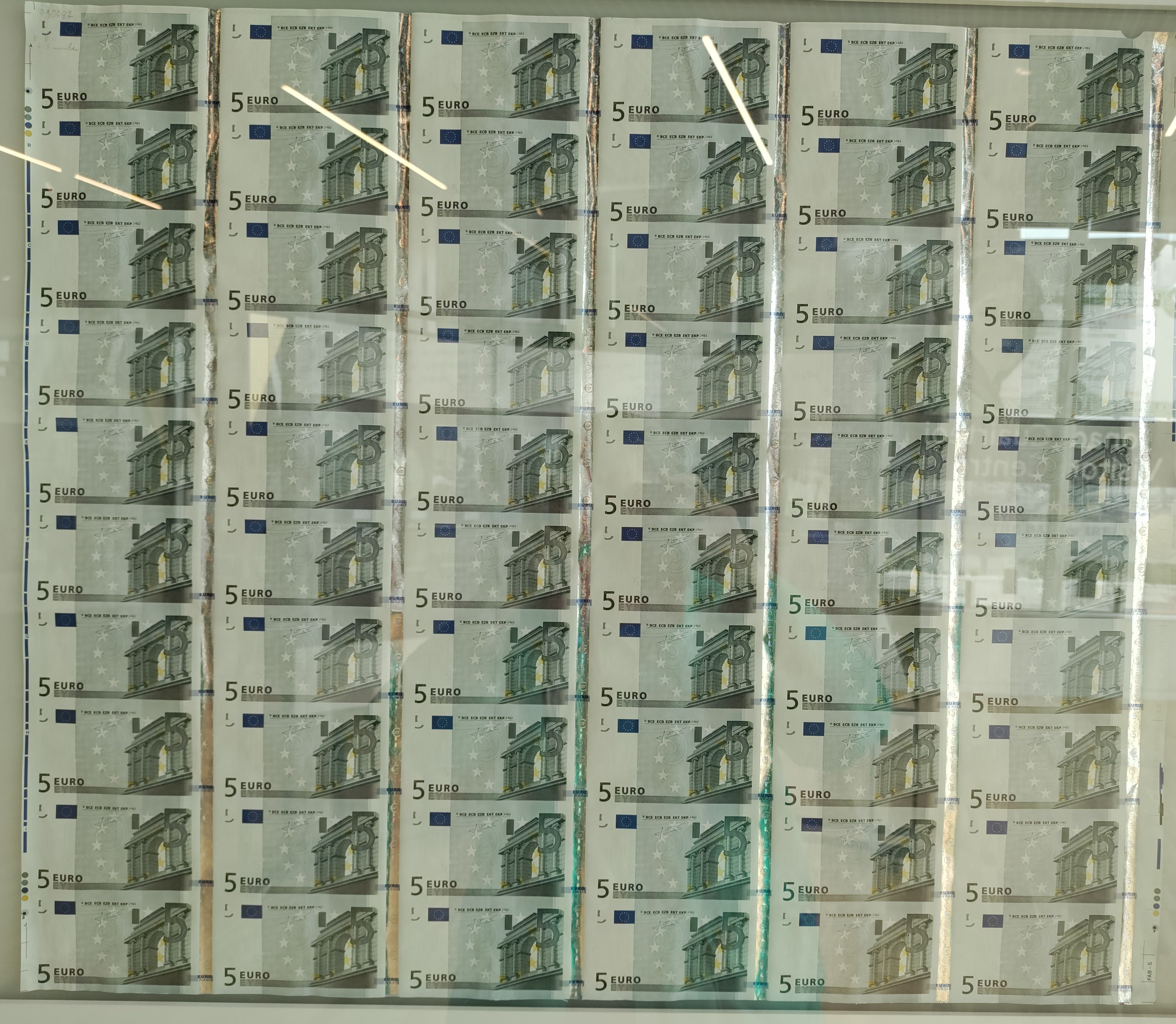 Sheet of five euro notes.