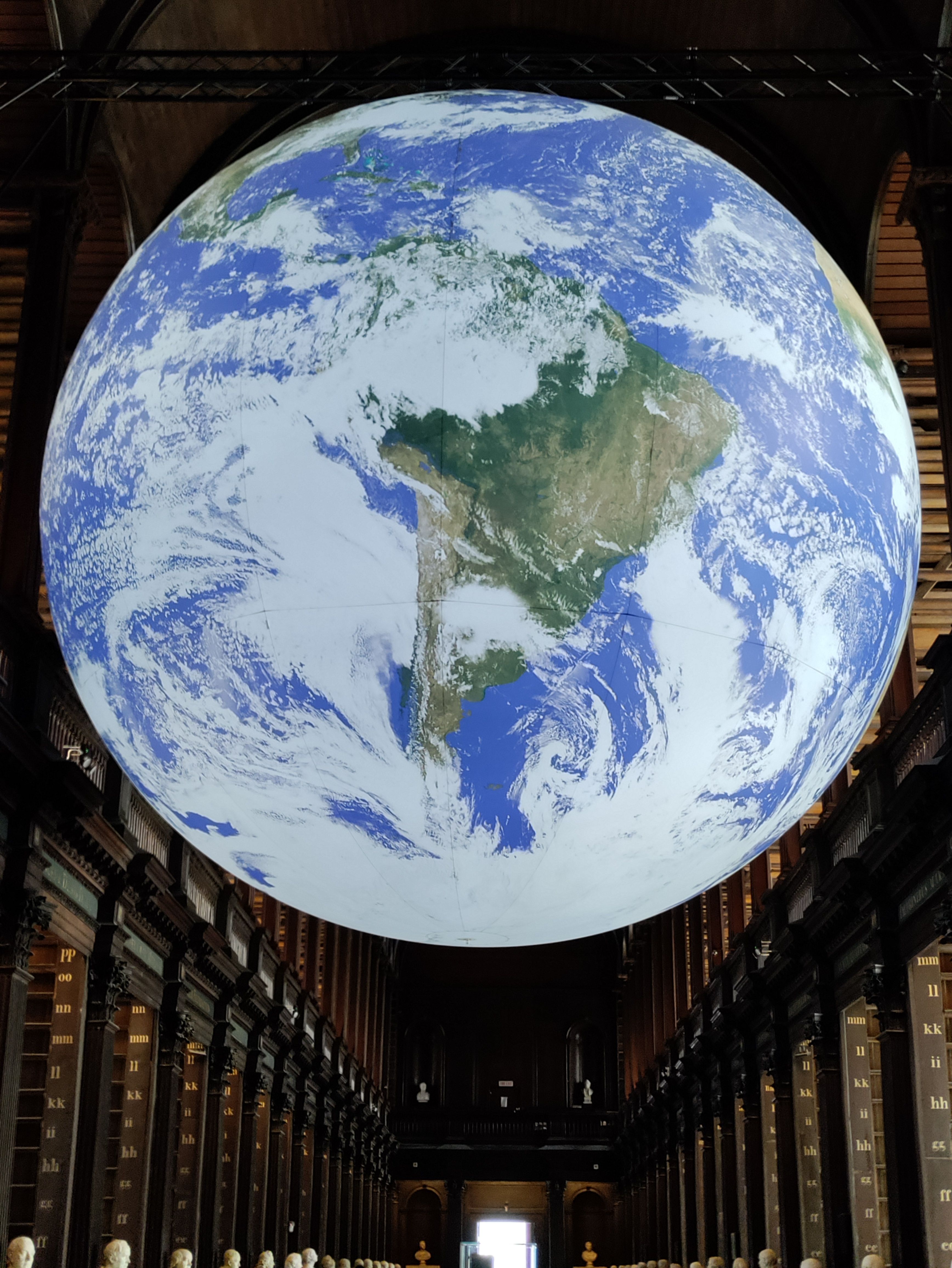 Slow spinning globe inside the Trinity College library.