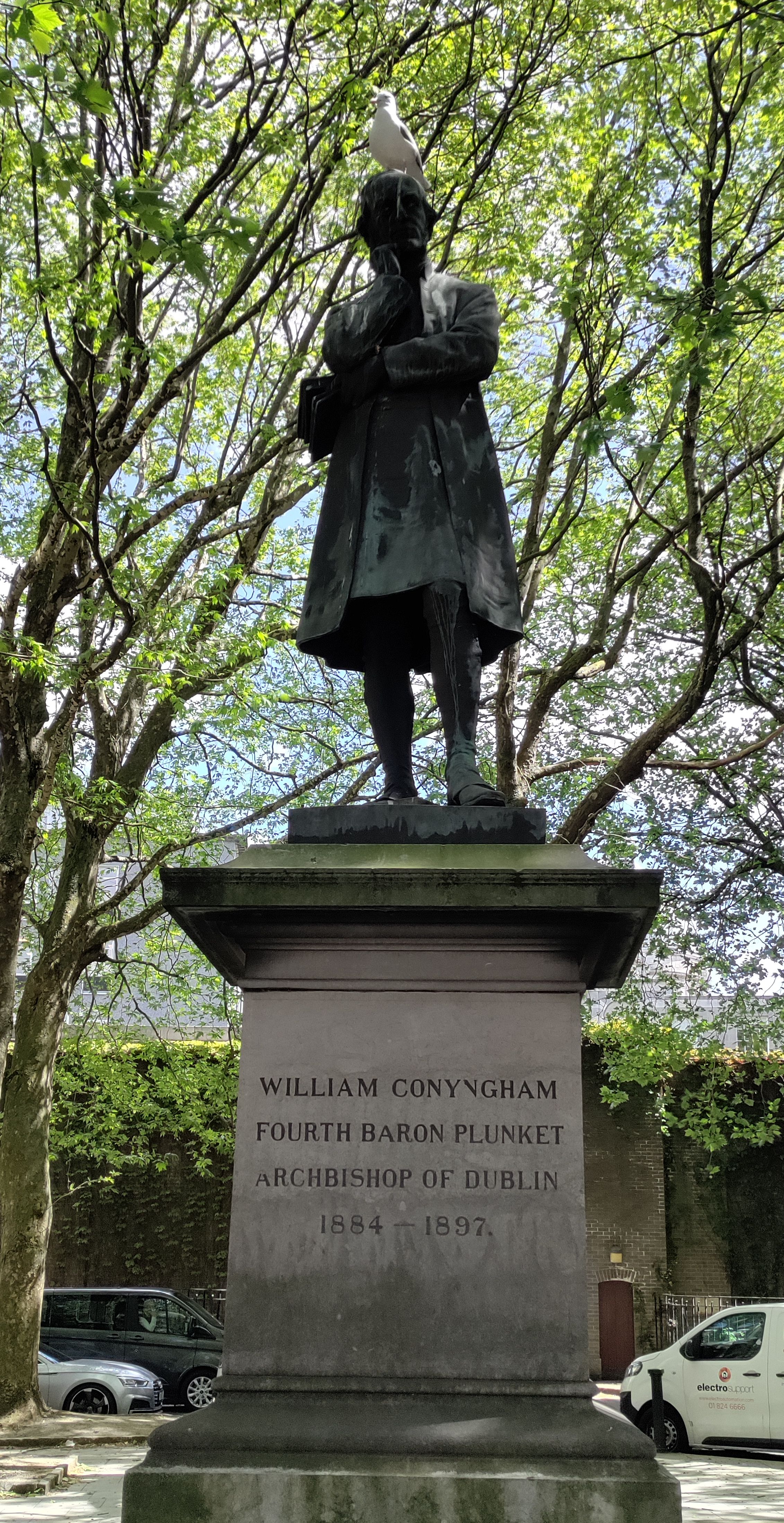 Bird perched on top of the statue of William Conyngham Plunket.